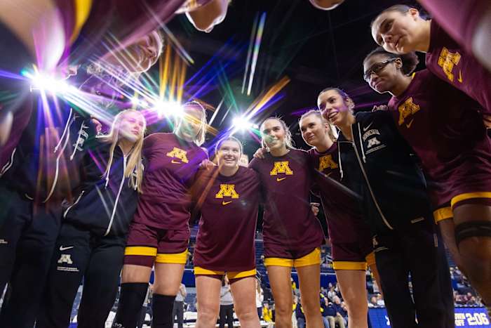 The Gophers huddle before their win over Michigan.